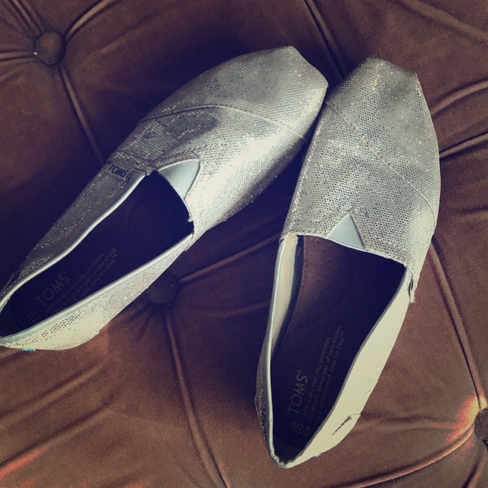 Toms silver slip-ons